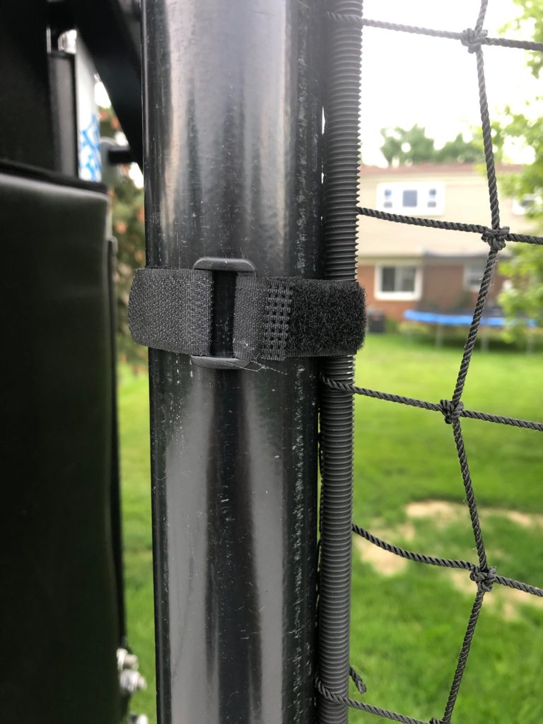 Closeup of Nylon Netting Connected to Steel Poles at a Residential Basketball Court Playing Area