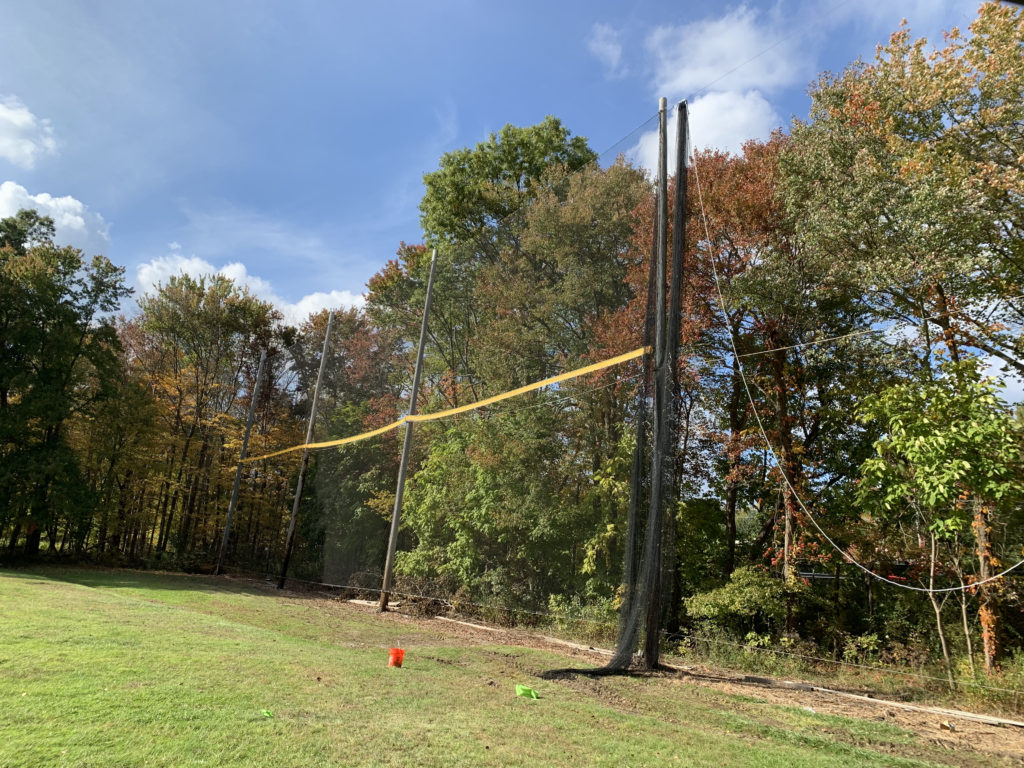 Golf range netting for golf ball containment.