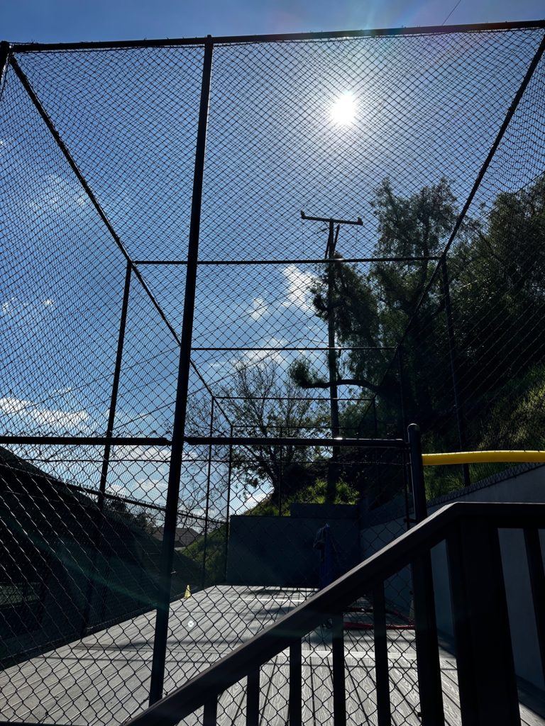 Nylon netting at a residential sports court to contain balls