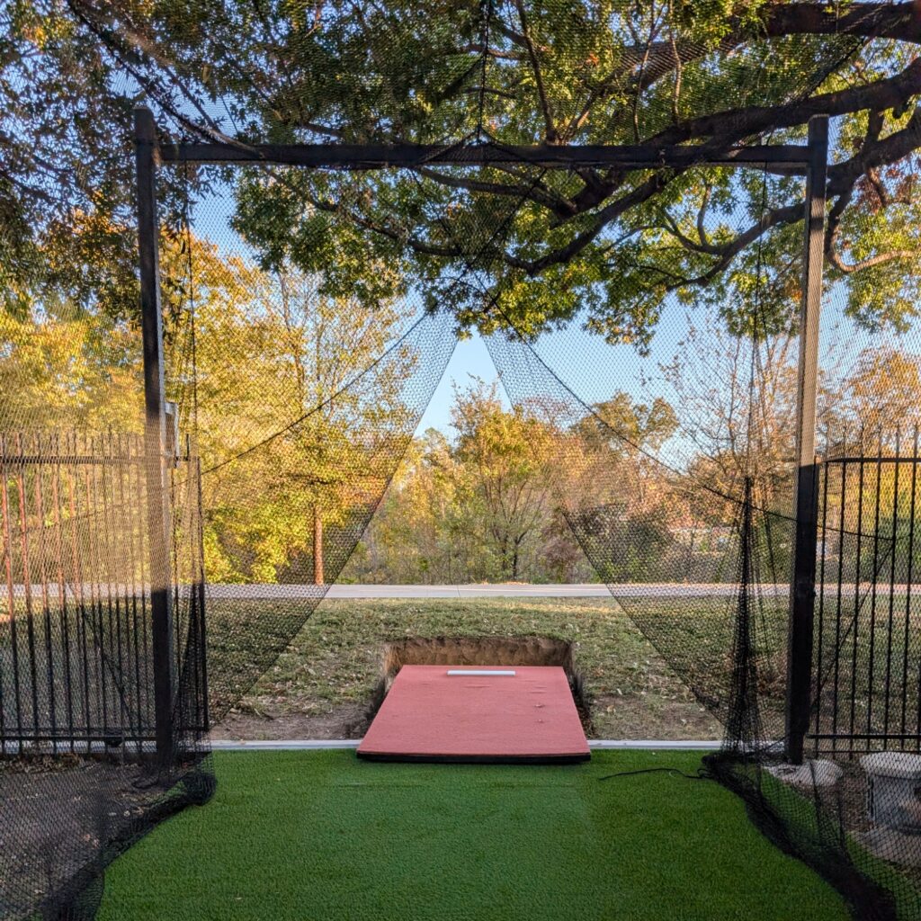 customized sports netting cage with pitching mound.